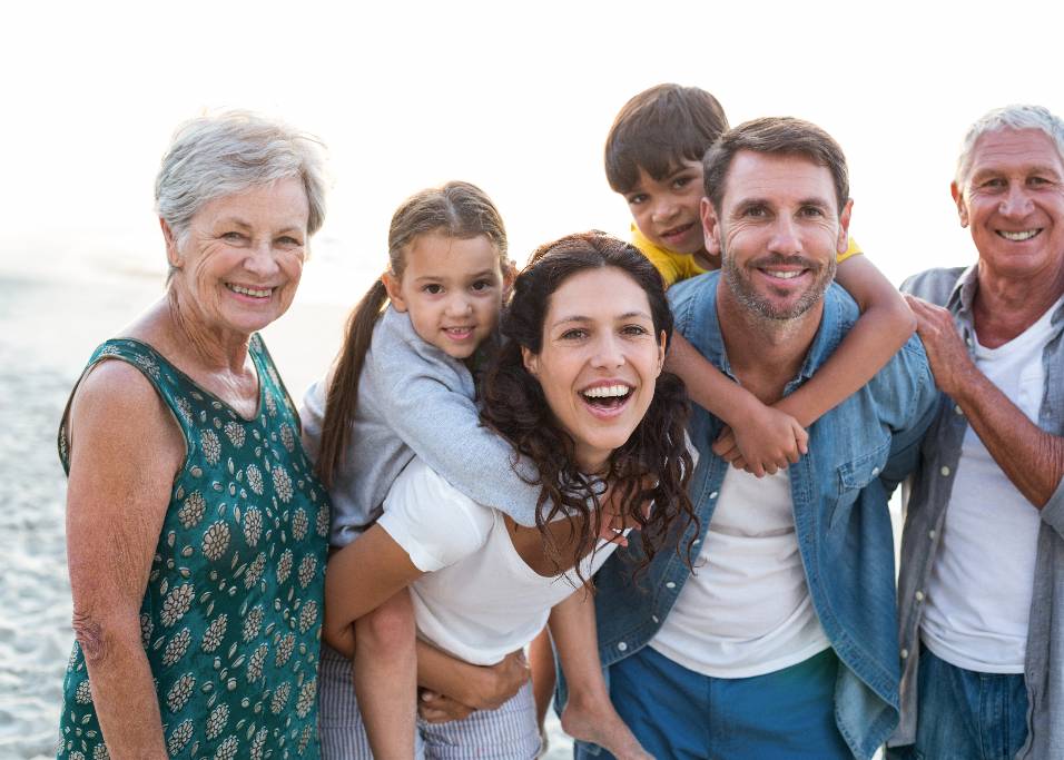 Happy family posing at the beach